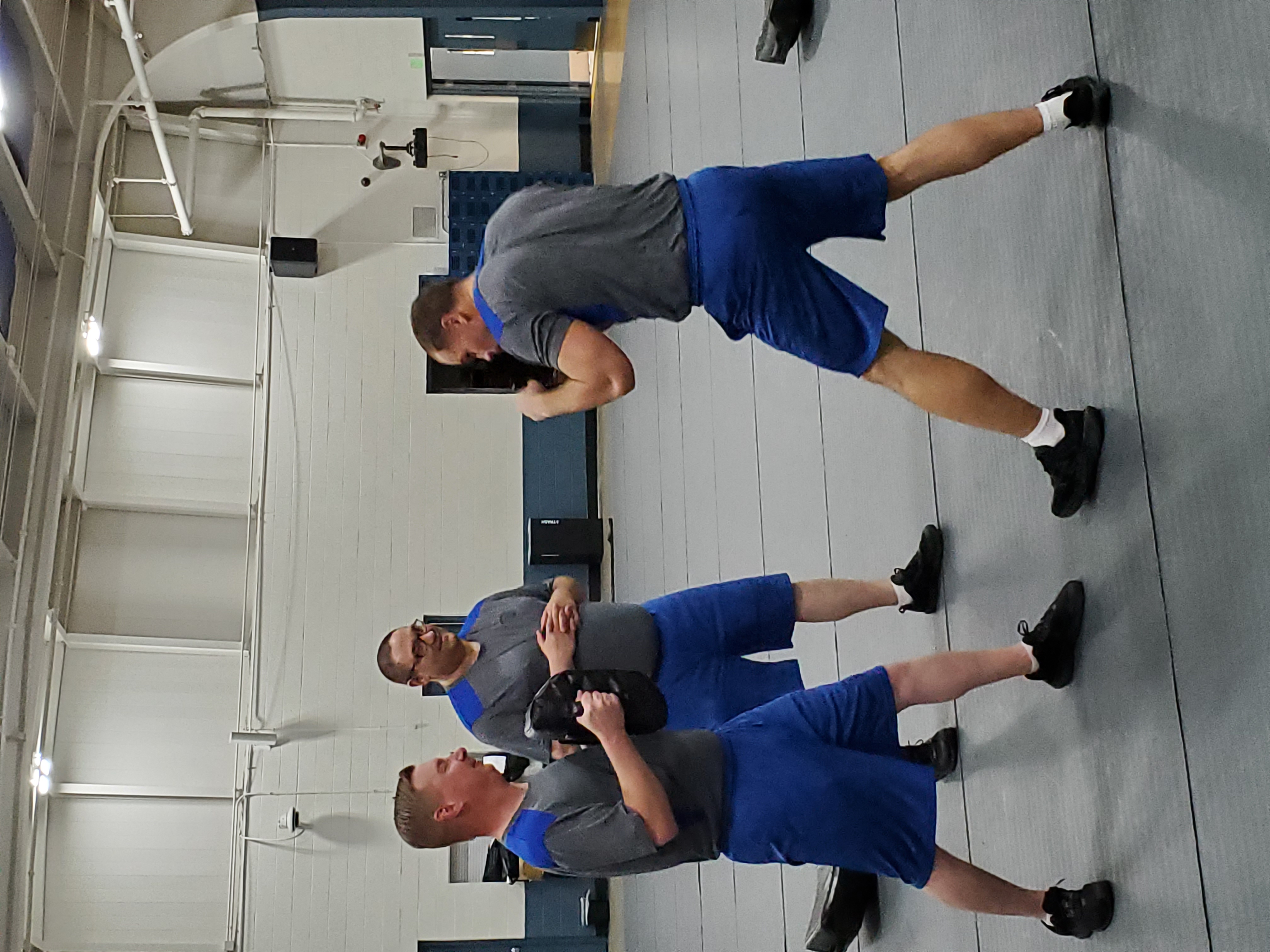 three Cadets training in defensive tactics. 